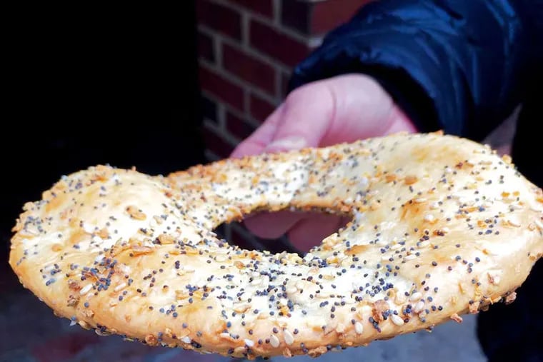 A "flagel" with everything spice from the new Chestnut Street Philly Bagels shop.  ( Craig LaBan / Staff )