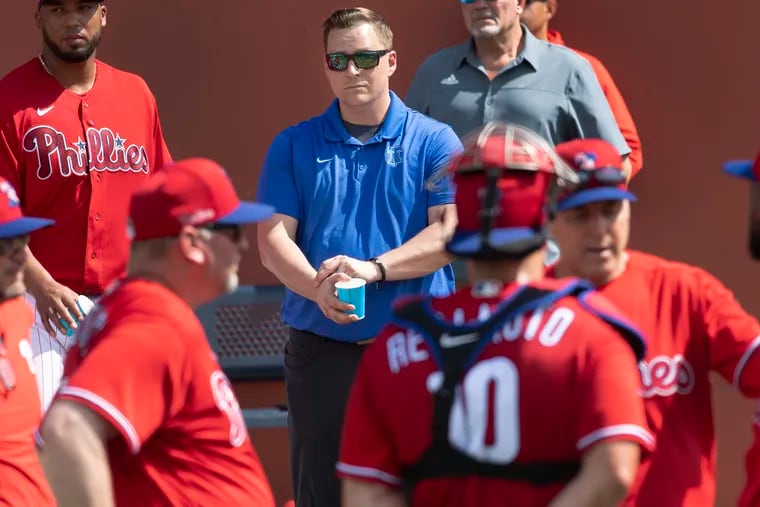 The Phillies hired Paul Buchheit, center, from the Boston Red Sox to take over as head athletic trainer. Scott Sheridan held the position for the last 13 years.