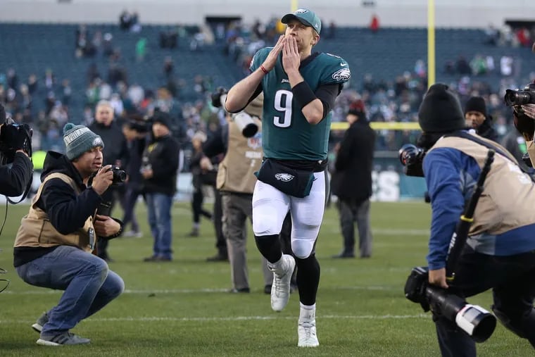 Eagles quarterback Nick Foles blows a kiss to the crowd as he leaves the field on Dec. 23 after what may have been his last game at Lincoln Financial Field, a 32-30 victory over Texas.