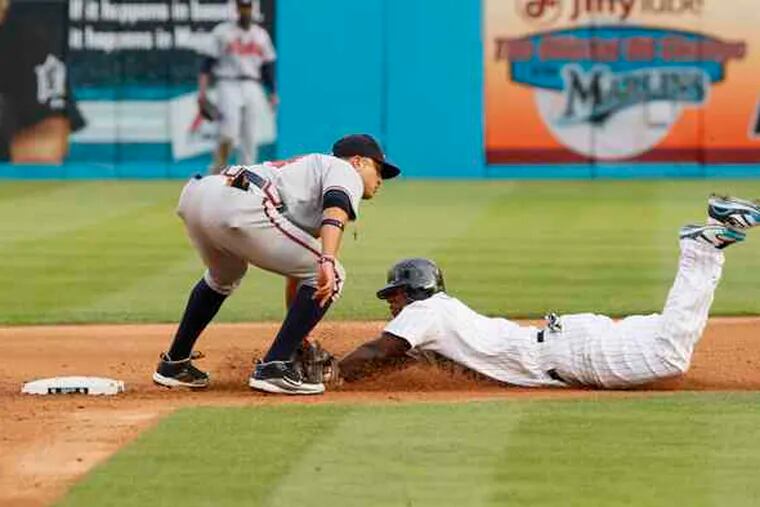 Braves second baseman Martin Prado tags out the Marlins' Hanley Ramirez after he tried to steal second. The Marlins won, 6-4.