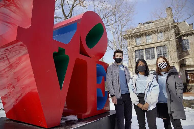From left, University of Pennsylvania junior Joey Lohmann and senior Preethi Kumaran, two of the founders of Lockdown Letters, and senior Jenny Chang, a program ambassador, stand for a portrait on the Penn campus in West Philadelphia on Saturday, Feb. 20, 2021. The initiative has collected more than 13,000 letters of gratitude to send to health care and other front line workers during the coronavirus pandemic.