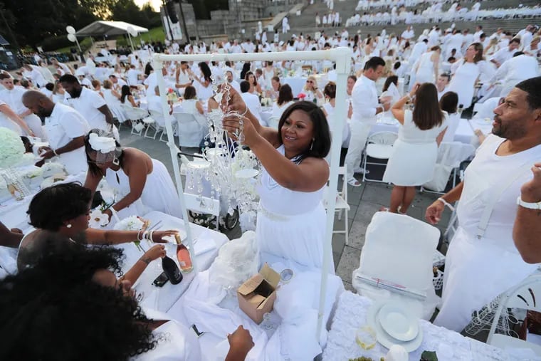 Marquita Treadwell decorates her table at 2016's Diner en Blanc on the Art Museum steps.