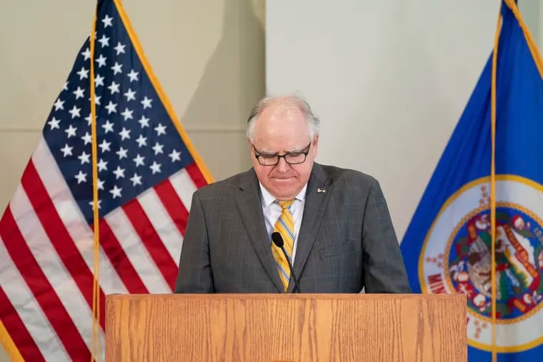 Minnesota Gov. Tim Walz pauses during a news conference Friday in St. Paul.