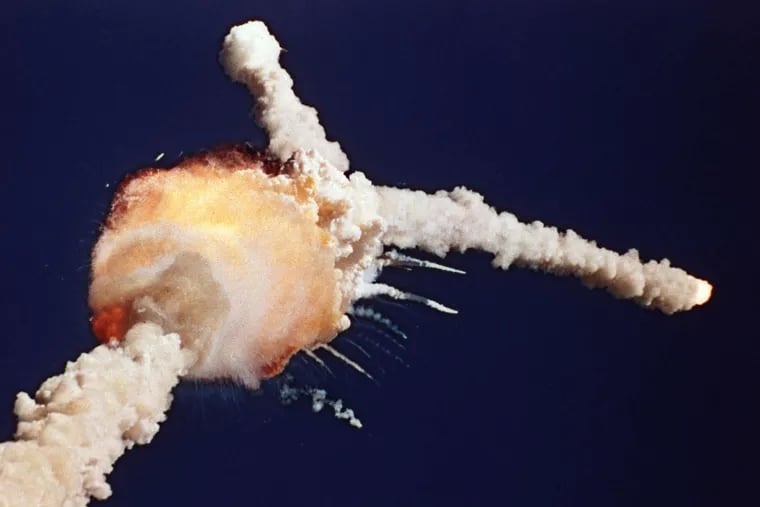 Challenger explodes shortly after liftoff from the Kennedy Space Center in Cape Canaveral, Fla., on Jan. 28, 1986. Christa McAuliffe, inset, was aboard as the first teacher in space.