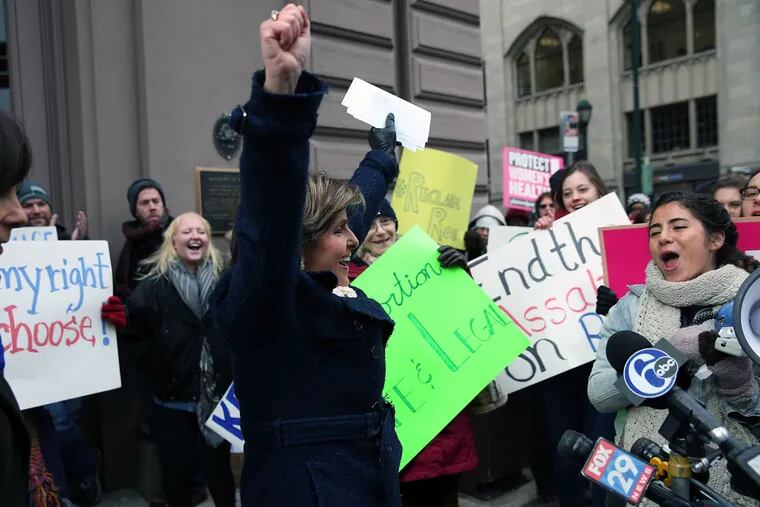 Feminist lawyer Gloria Allred cheers after joining a pro-abortion-rights group at Broad and Locust Streets. She told of nearly losing her life due to an illegal abortion she had after being raped.