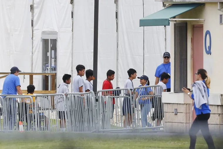 In June, immigrant children walked in a line outside the Homestead Temporary Shelter for Unaccompanied Children, a former Job Corps site that now houses them in Homestead, Fla.
