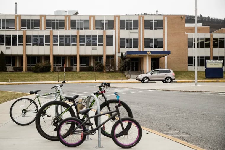 Bicycles are parked outside Tamaqua Area High School in Tamaqua, Pa., Friday, Jan. 4, 2019. Parents are going to court to block the Tamaqua Area School District from allowing teachers to carry guns in school. (AP Photo/Matt Rourke)