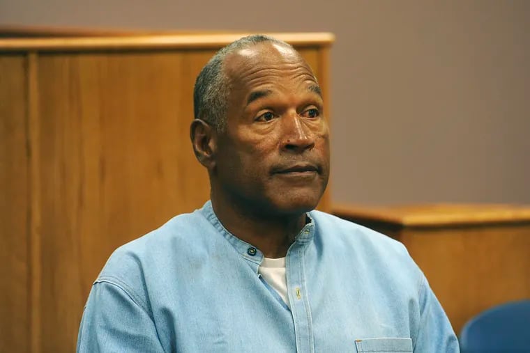 FILE - In this July 20, 2017 file photo, former NFL football star O.J. Simpson appears via video for his parole hearing at the Lovelock Correctional Center in Lovelock, Nev.  Simpson has launched a Twitter account with a video post in which the former football star says he’s got a “little gettin’ even to do.” Simpson confirmed the new account to The Associated Press on Saturday, June 15, 2019. Simpson said in a phone interview it will be a lot of fun and that he had some things to straighten out. (Jason Bean/The Reno Gazette-Journal via AP, Pool, File)