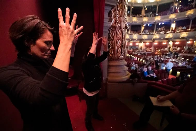 ASL interpreters from Hands UP Productions Charity Johnson (left) and Beth Applebaum, rehearse sign prior to Tuesday's "Mean Girls" show at the Academy of Music