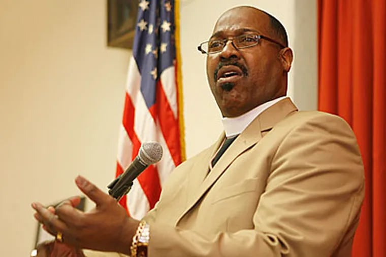 The Mayor's Office for Faith-based Initiatives is sponsoring a meeting about "peaceful surrender" for fugitives. The Rev. Ernest McNear, pastor of the True Gospel Tabernacle Church, speaks at the meeting. ( Charles Fox / Staff Photographer )