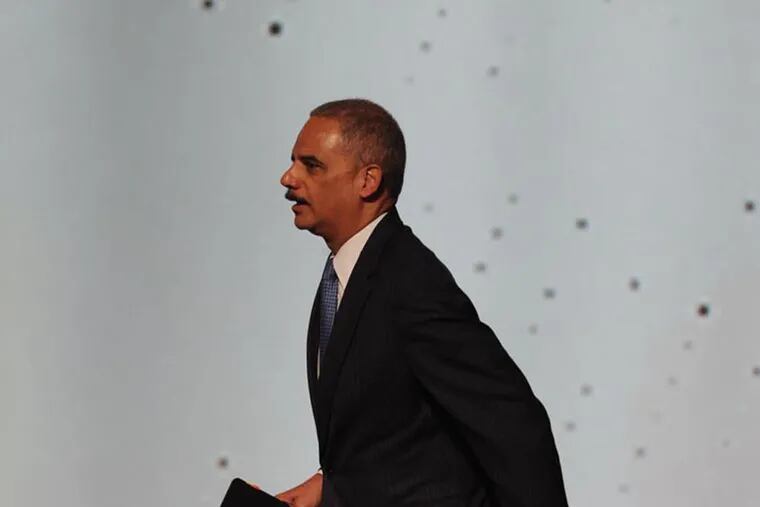 US Attorney General Eric Holder walks up on stage as he is introduced to the 2013 National Urban League Conference in Philadelphia July 25, 2013.  Holder told the attendees that the Justice Department will be opening a new initiative to combat the erosion of the Voting Rights Act by the Supreme Court.  ( CLEM MURRAY / Staff Photographer )