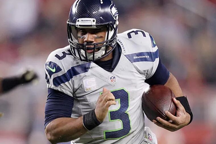Seattle Seahawks quarterback Russell Wilson (3) runs the ball against the San Francisco 49ers in the fourth quarter at Levi's Stadium. The Seahawks defeated the 49ers 19-3. (Cary Edmondson/USA Today)