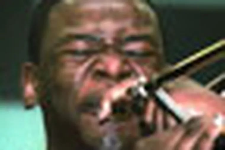 P-JAZZ08 Sharon Gekoski-Kimmel JREG 6-7-01 Pennsauken: Ernest Stuart, 17 yrs old, plays his heart out on his trombone. Stuart is a member of the Pennsauken High School Jazz Band . They are going to play at Birdland. Reporter Vansant. 1/2