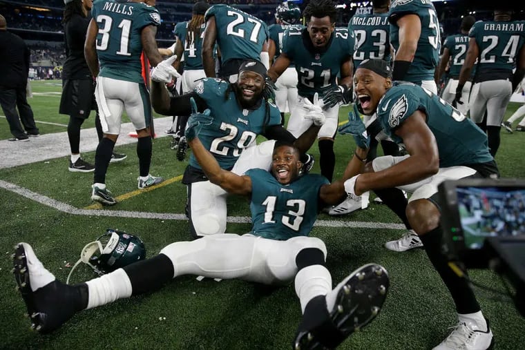Eagles left to right: LeGarrette Blount, Nelson Agholor, Patrick Robinson, and Rasul Douglas pose on the sideline as the Philadelphia Eagles win 37-9 over the Dallas Cowboys in  Arlington, Texas on November 19, 2017.