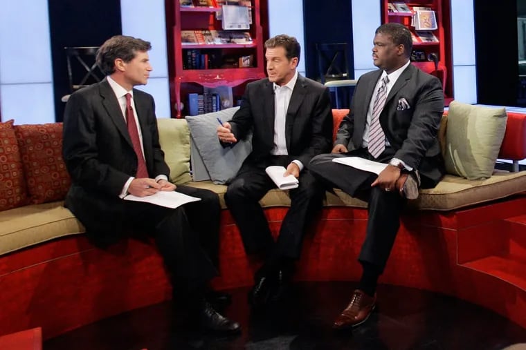 Charles Payne (right) on a Fox Business set alongside Peter Barnes (left) and Eric Bolling (center). Payne has been suspended by the network over allegations of sexual harassment.