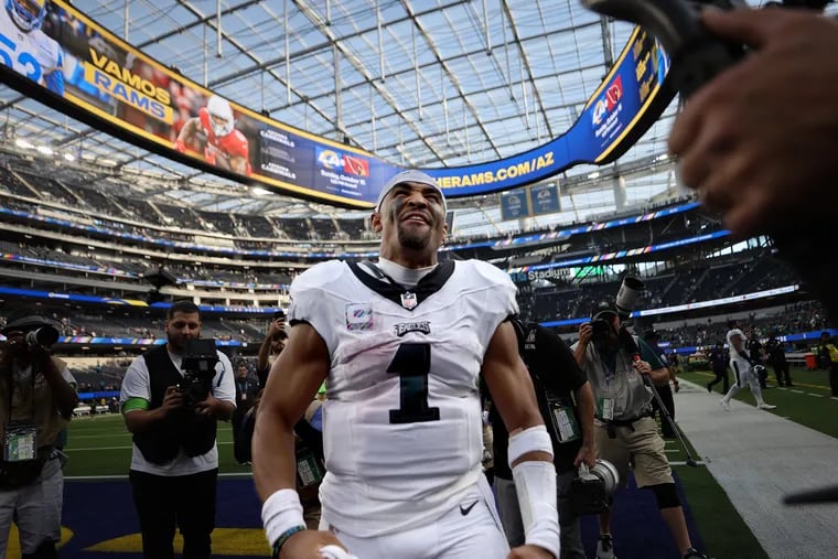 Eagles quarterback Jalen Hurts celebrates as he walks off the field after defeating the Rams at SoFi Stadium.