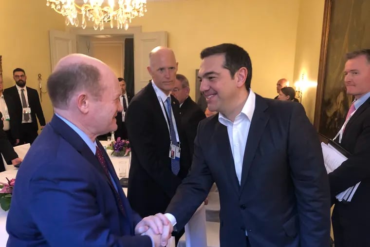 Sen. Chris Coons of Delaware (left) with Greek Prime Minister Greek Prime Minister Alexis Tsipras at the Munich Security Conference last month.