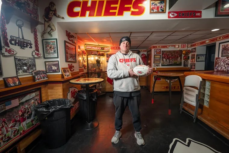 Michael Puggi, who grew up down the block from Big Charlie's Saloon, shown here at the bar in South Philadelphia with Kansas City Chiefs memorabilia, Friday, February 3, 2023.