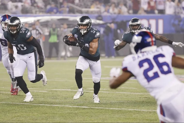 Eagles linebacker Kamu Grugier-Hill runs with the football after a interception against the New York Giants on Thursday, October 11, 2018 in East Rutherford, NJ. YONG KIM / Staff Photographer
