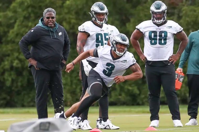 Eagles’ defensive tackle Jalen Carter (98) watches edge rusher Nolan Smith (3) during rookie minicamp earlier this month.