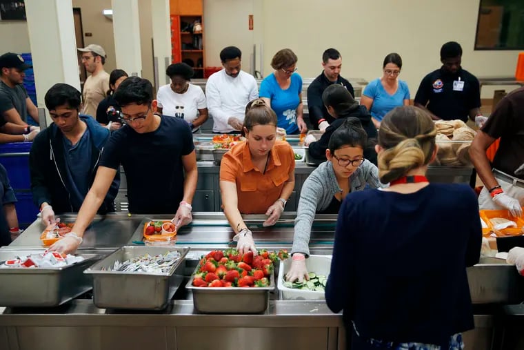 Volunteers put together food trays at Three Square, a food bank in Las Vegas on March 26, 2019. Sin City’s world-famous casinos in recent years have developed and expanded innovative practices to cut back on food waste, which is a problem nationwide.