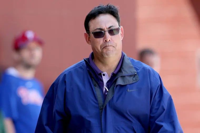 Then-Phillies general manager Ruben Amaro Jr. walking at the Carpenter Complex watching minor-league players on March 25, 2014.
