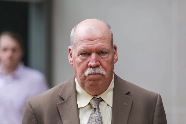 John I. Waltman, a former district judge in Bucks County, leaves a federal courtroom in Philadelphia on Monday after being sentenced to 6 1/2 years in prison for corruption.