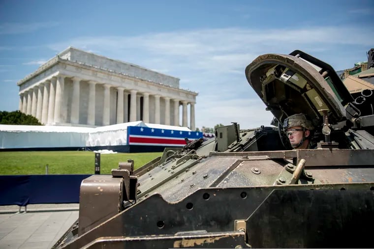 One of two Bradley Fighting Vehicles waits to be driven into place in front of the Lincoln Memorial for President Donald Trump's 'Salute to America' event honoring service branches on Independence Day, Wednesday, July 3, 2019, in Washington. President Donald Trump is promising military tanks along with "Incredible Flyovers & biggest ever Fireworks!" for the Fourth of July.