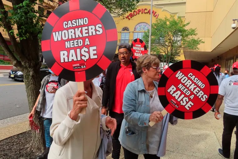Members of Local 54 of the Unite Here casino workers union picket outside the Tropicana casino in Atlantic City June 1 after contracts expired.