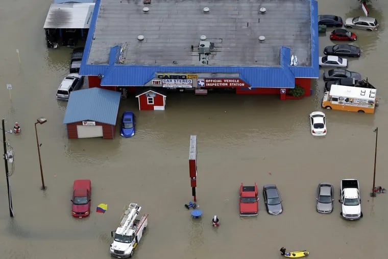 Houston businesses and cars flooded by Harvey.