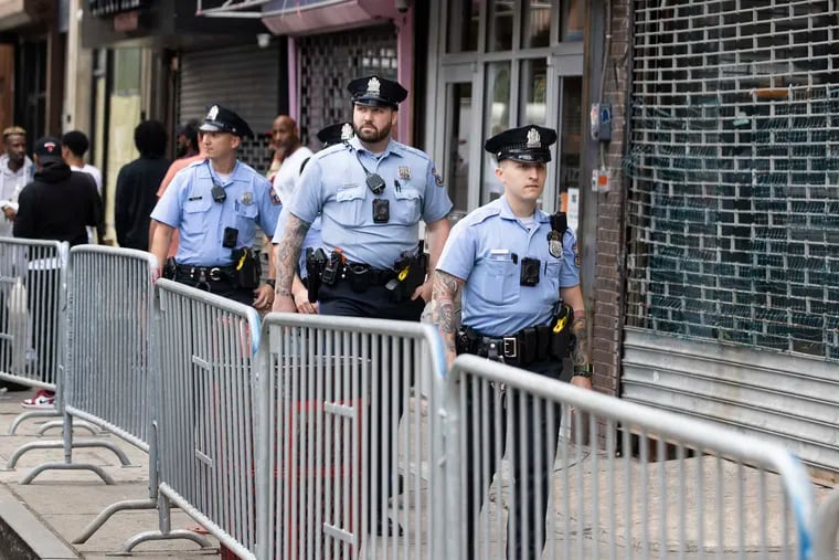 Police patrol on South Street the week after a mass shooting took place on the popular Philadelphia commercial corridor. The department is set to see a $30 million funding increase under the new city budget.