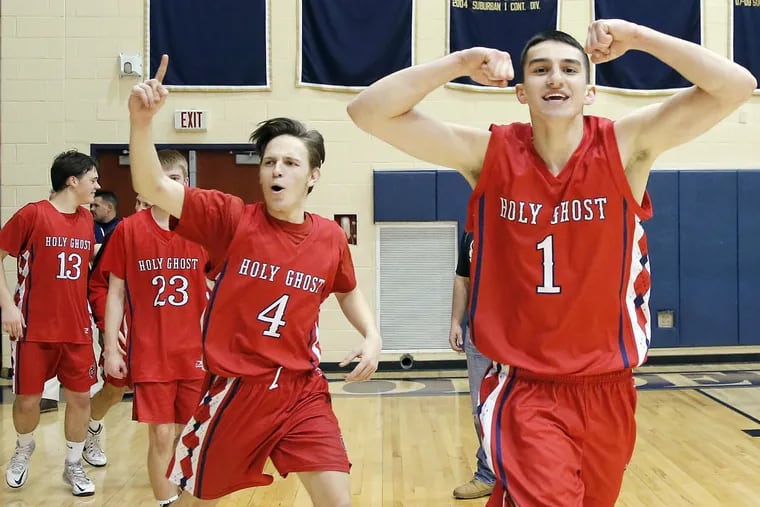 Holy Ghost Prep's Mike McFadden (#1) and Kyle Cartin (#4) celebrates their win over Lower Moreland High for the PIAA District 1 Class AAA boys' basketball championship on Saturday, February 27, 2016.