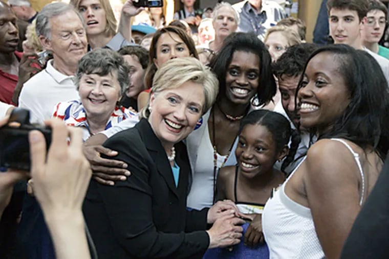 Sen. Hillary Rodham Clinton, D-N.Y, poses for a picture with supporters Saturday at the National Building Museum in Washington after she suspended her campaign for president. (AP Photo/Susan Walsh)