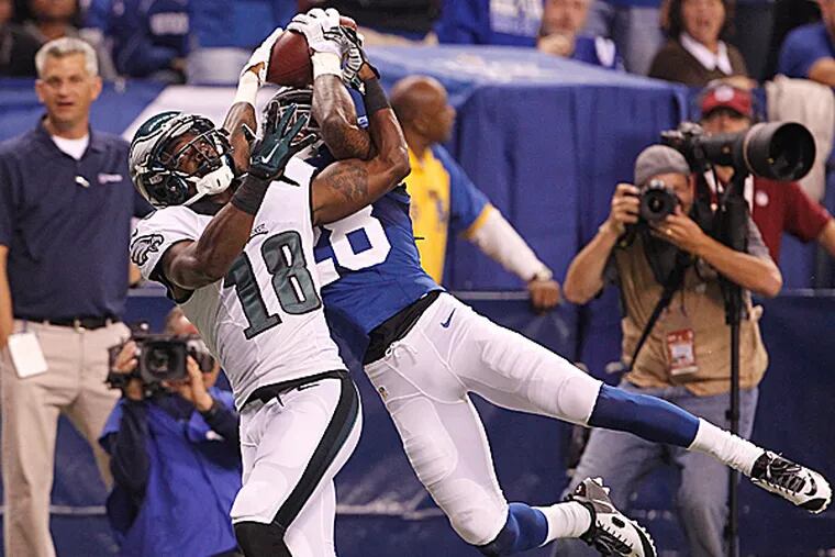 Eagles wide receiver Jeremy Maclin watches as Colts defensive back Greg Toler intercepts the ball. (Ron Cortes/Staff Photographer)