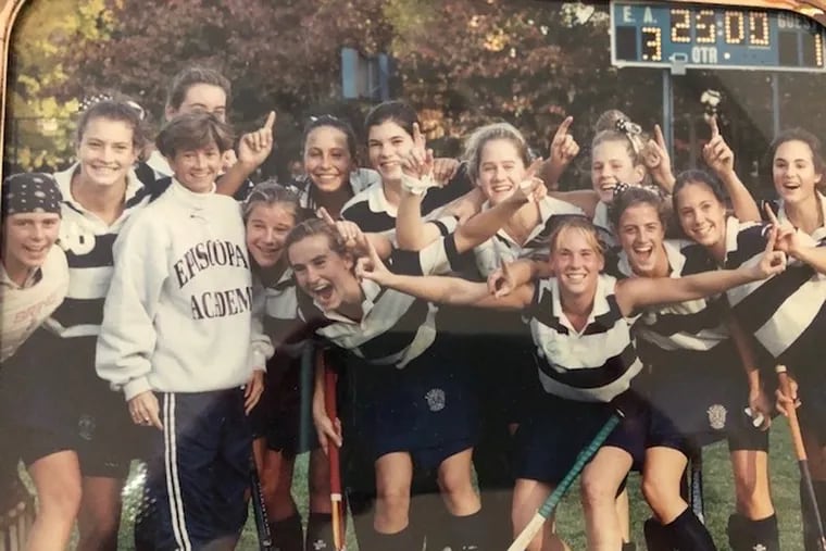 Former Episcopal Academy AD Gina Buggy (third from left) poses with her field hockey team in the 1980s.