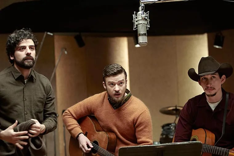 Oscar Isaac (left) plays the title character in the Coen Brothers' new film, with Justin Timberlake (center), Adam Driver. (ALISON ROSA / CBS Films)