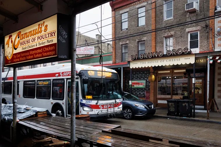 SEPTA's Route 47M bus passes Di Bruno Bros.' first store on Ninth Street in South Philadelphia on April 1, 2024. The brand now includes five stores, plus several smaller outlets and a catering company.