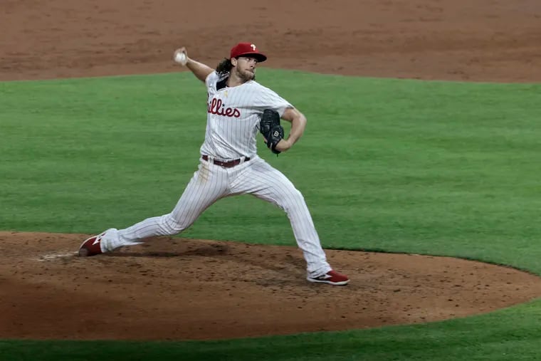 Aaron Nola throws a pitch during Saturday's game. He allowed four runs on seven hits in 4⅓ innings.