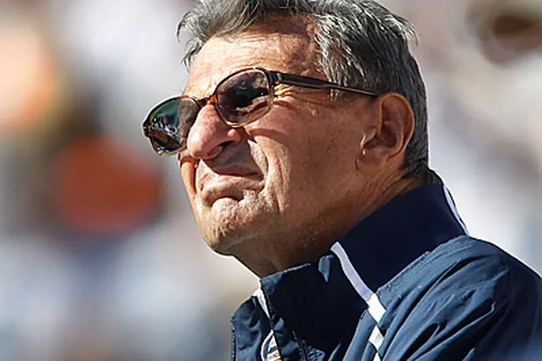 Joe Paterno looks up at the scoreboard as his Penn State team was trailing Illinois in the fourth quarter.  (AP Photo/Keith Srakocic)