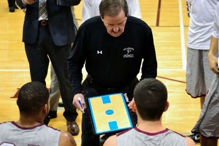 Herb Magee discusses strategy with his players during Wednesday’s victory over Georgian Court. (C.F. Sanchez/Staff Photographer)