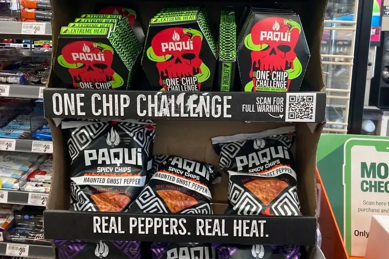 Paqui One Chip Challenge chips are displayed at a 7-Eleven store in Boston, Thursday, Sept. 7, 2023, before they were removed the following day. A medical examiner says a Massachusetts teen who participated in a spicy tortilla chip challenge died from ingesting a substance “with a high capsaicin concentration,” according to autopsy results The Associated Press obtained late Wednesday, May 15, 2024. Capsaicin is a chili pepper extract. Harris Wolobah died on Sept. 1, 2023, after eating the chip. (AP Photo/Steve LeBlanc, File)