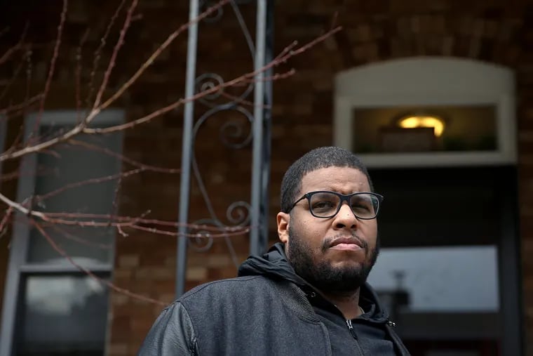 Spencer A. Hill Jr., an associate at Ballard Spahr, stands outside his West Philadelphia home on Thursday, March 7, 2019. Hill was shot on his block in an apparent robbery attempt Monday night.