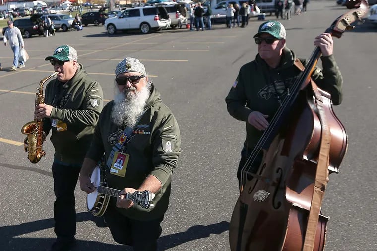 Members of the Eagles Pep Band, (L-R) Brian Saunders, Anthony Dimeo, and Bruce Mulford, play in the H Lot before the Philadelphia Eagles play the Miami Dolphins at Lincoln Financial Field in Philadelphia, Pa. on November 15, 2015.