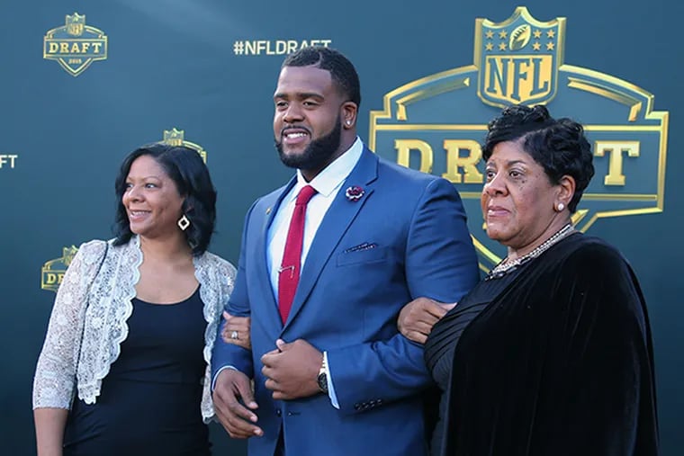 Donovan Smith (Penn State) and Sharon Thomas and Kim Denise Smith arrive on the gold carpet before the first round of the 2015 NFL Draft at the Auditorium Theatre of Roosevelt University. (Dennis Wierzbicki/USA Today)