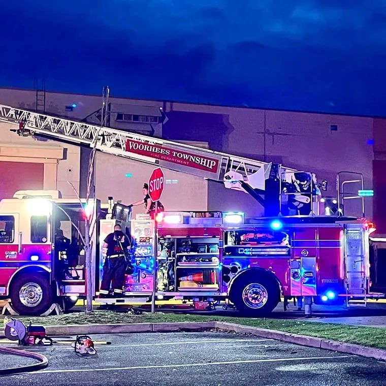 Firefighters respond to fire inside the Voorhees Town Center mall Friday evening. No injuries were reported, but the shopping center will be closed for the weekend.