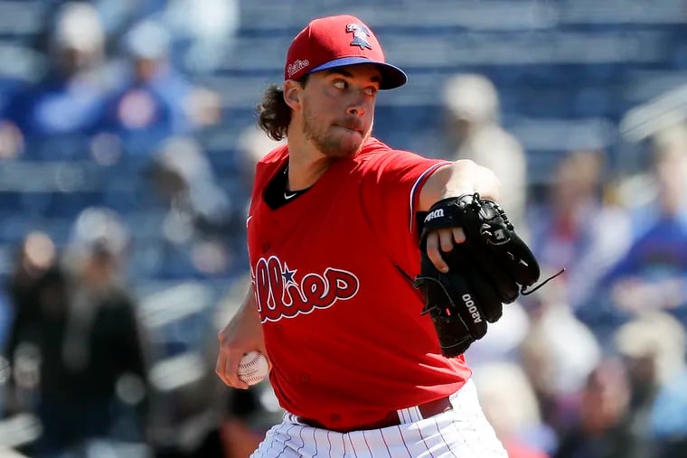 Aaron Nola throws in the first inning against the Atlanta Braves on Friday.