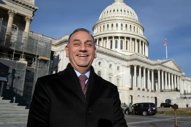 In this Nov. 29, 2018 photo, Rep.-elect Gil Cisneros, D-Calif., stands in front of the Capitol during a week of orientation for incoming members, in Washington. This year’s midterm election is sending a record 43 Latinos to Congress.  (AP Photo/J. Scott Applewhite)