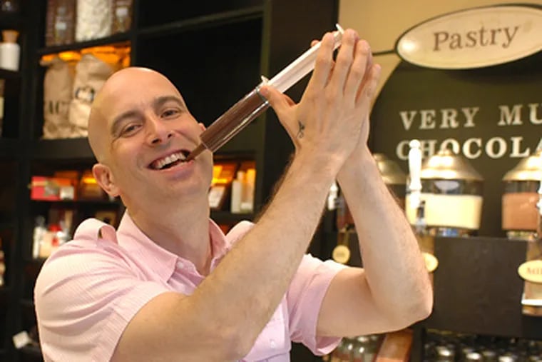 Max Brenner fashions himself a modern Willy Wonka at his new Chocolate Bar and Restaurant in Center City.  (James Heaney / Staff Photographer)