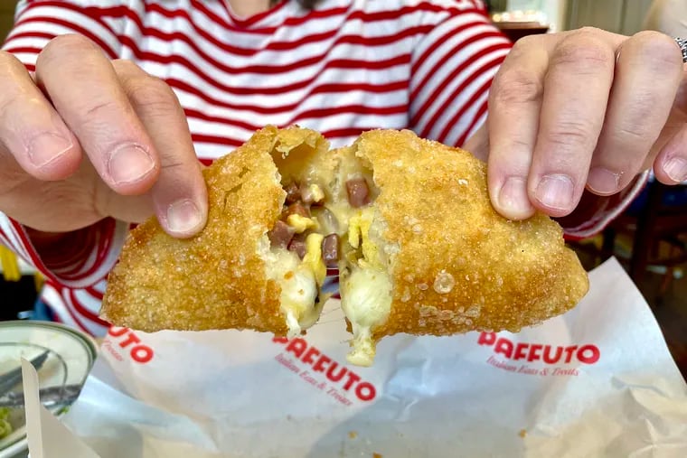 A breakfast panzerotti from Paffuto in South Philadelphia is stuffed scrambled eggs, Cooper Sharp cheese and ham.