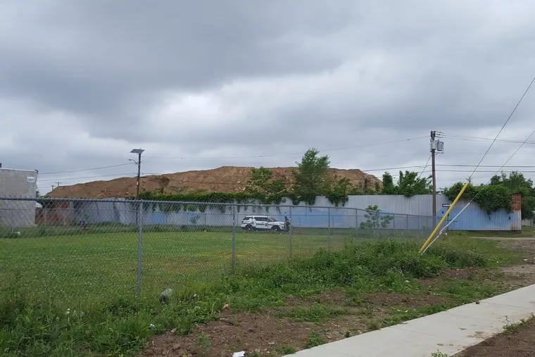A view of Yaffa & Sons in Camden.  State officials have asked a court to order an immediate cleanup of the illegal dump site in Camden that is comprised of contaminated waste several stories high and is â€œspreading onto neighboring properties, sidewalks, and roadways, threatening the safety and health of local residents and the environment.â€